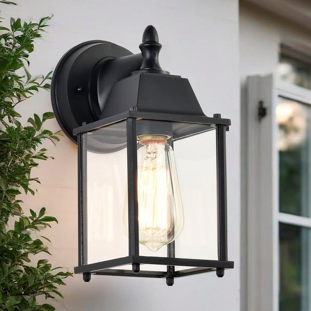 Black outdoor wall lantern beside a warm front porch entry
